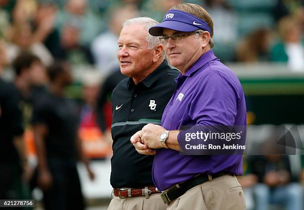 Head coach Jim Grobe of the Baylor Bears, left, and head coach Gary Patterson, right, of the TCU Horned Frogs talk at midfield before the Bears take...