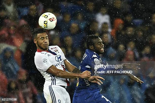 Lyon's French midfielder Coretin Tolisso vies with Bastia's Malian midfielder Lassana Coulibaly during the French L1 football match Olympique...