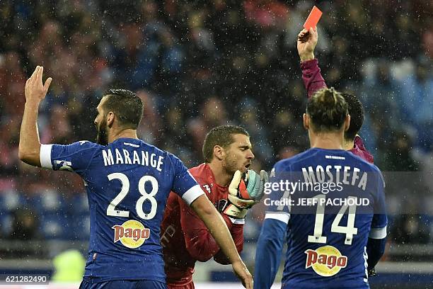 Bastia's French goalkeeper Jean Louis Leca is shown a red card during the French L1 football match Olympique Lyonnais vs Bastia on November 5 at the...