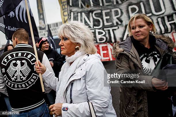 Right-wing activists gather in front of Hauptbahnhof main railway station before marching through the city center on November 5, 2016 in Berlin,...