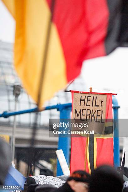 Right-wing activists gather in front of Hauptbahnhof main railway station before marching through the city center on November 5, 2016 in Berlin,...