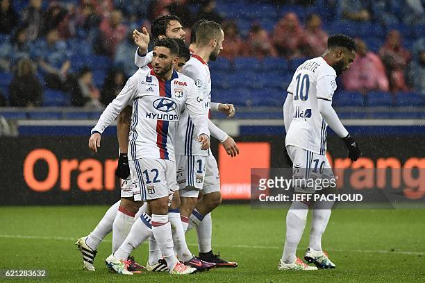 Lyon players celebrate Bastia's own goal during the French L1 football match Olympique Lyonnais vs Bastia on November 5 at the Parc Olympique...