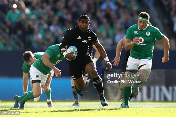 Waisake Naholo of New Zealand makes a break during the international match between Ireland and New Zealand at Soldier Field on November 5, 2016 in...