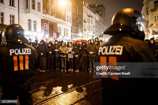 Left-wing activists block the road to stop right-wing activists marching through the city center on November 5, 2016 in Berlin, Germany. According to...