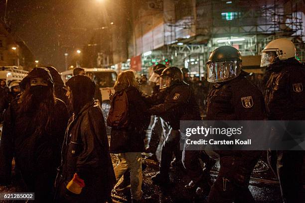Left-wing activists block the road to stop right-wing activists marching through the city center on November 5, 2016 in Berlin, Germany. According to...