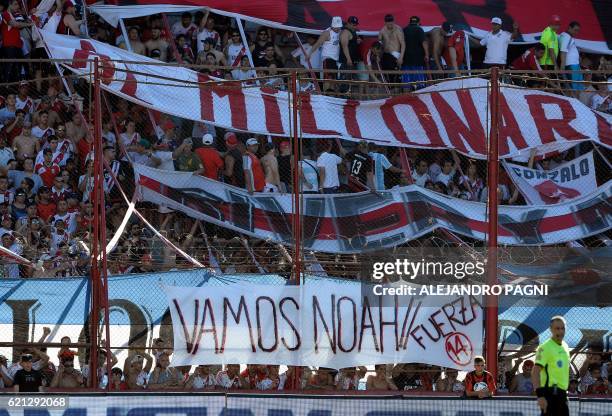 Supporters of River Plate display a flag reading "Go Noah! Strength" showing support to the 3-year-old son of Canadian singer Michael Buble and...