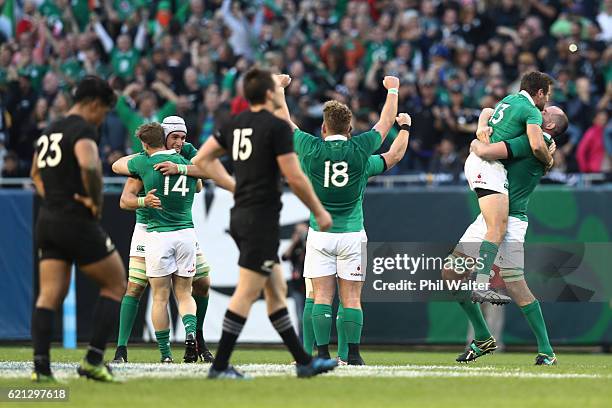 Ireland players celebrate their 40-29 victory as the final whistle blows during the international match between Ireland and New Zealand at Soldier...