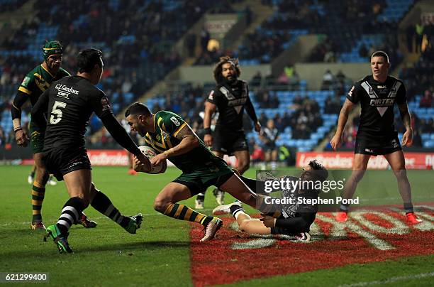 Shaun Johnson of New Zealand and Darius Boyd of Australia compete for the ball during the Four Nations match between the New Zealand and Australia at...