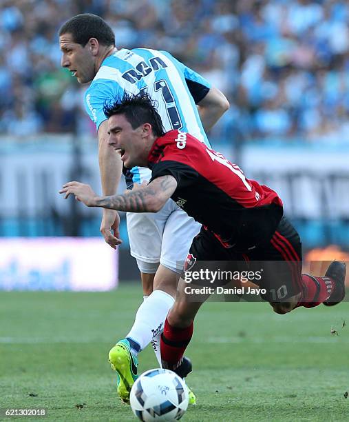 Mauro Formica, of Newell's Old Boys, and Luciano Aued, of Racing Club, battle for the ball during a match between Racing Club and Newell's Old Boys...