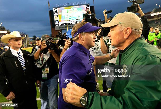 Head coach Gary Patterson of the TCU Horned Frogs, left, and head coach Jim Grobe of the Baylor Bears, right, meet at midfield following TCU's win...