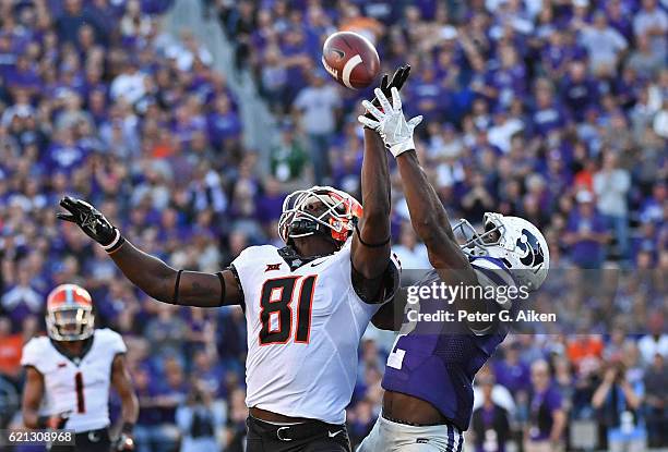 Defensive back D.J. Reed of the Kansas State Wildcats intercepts the pass from wide receiver Jhajuan Seales of the Oklahoma State Cowboys during the...