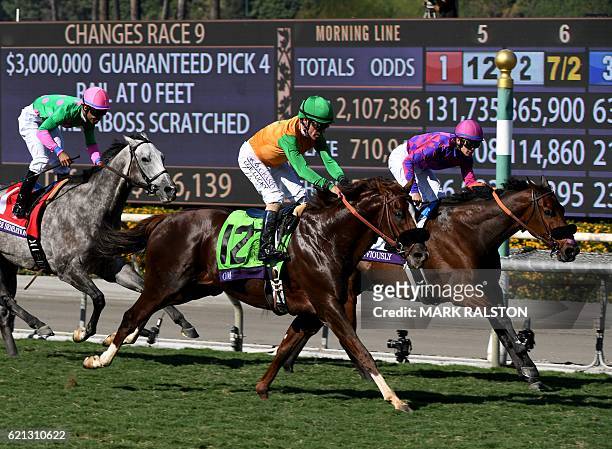 Jockey Flavien Prat riding Obviously wins the Breeders' Cup Turf Sprint race during day two of the 2016 Breeders' Cup World Championships at the...