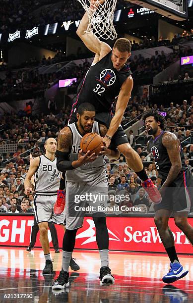 Blake Griffin of the Los Angeles Clippers falls on LaMarcus Aldridge of the San Antonio Spurs after a rebound during the game between Los Angeles...