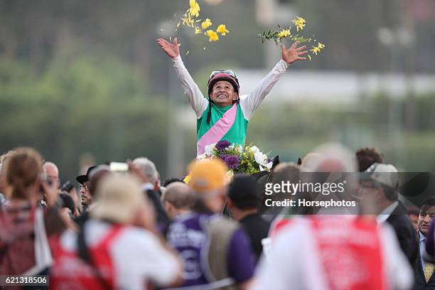 Mike Smith tosses flowers in the air after winning the Breeders' Cup Classic on Arrogate at Santa Anita Park, CA during day two of the 2016 Breeders'...