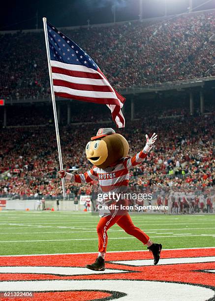 Brutus The Buckeye running with the American flag during the second quarter of the game against the Nebraska Cornhuskers on November 5 at the Ohio...