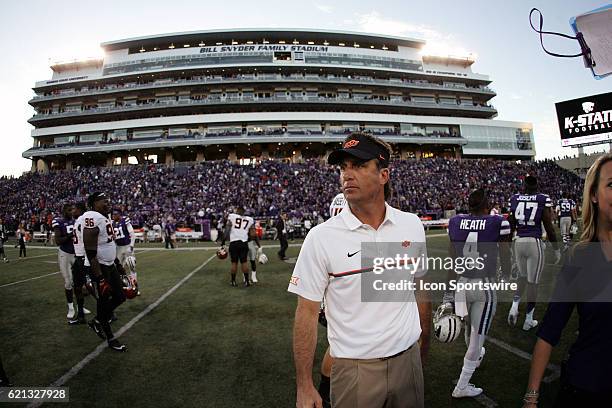 Oklahoma State Cowboys head coach Mike Gundy congratulates players after the game against the Kansas State Wildcats on November 5 at Bill Snyder...