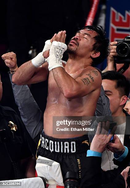 Manny Pacquiao celebrates his unanimous-decision victory over Jessie Vargas to win the WBO welterweight championship title at the Thomas & Mack...