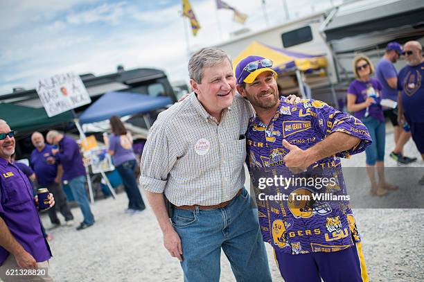 John Kennedy, Republican candidate for the U.S. Senate from Louisiana, greets a fan at a tailgate before a football game between the Louisiana State...