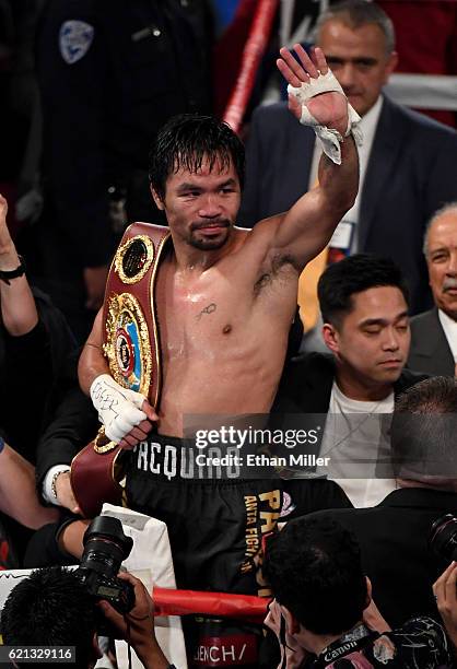 Manny Pacquiao celebrates his unanimous-decision victory over Jessie Vargas to win the WBO welterweight championship title at the Thomas & Mack...