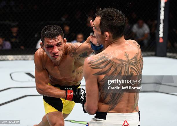 Rafael Dos Anjos of Brazil punches Tony Ferguson of the United States in their lightweight bout during the UFC Fight Night event at Arena Ciudad de...