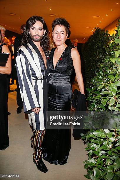 Austrian singer Conchita Wurst and german moderator Dunja Hayali attend the 23rd Opera Gala at Deutsche Oper Berlin on November 5, 2016 in Berlin,...