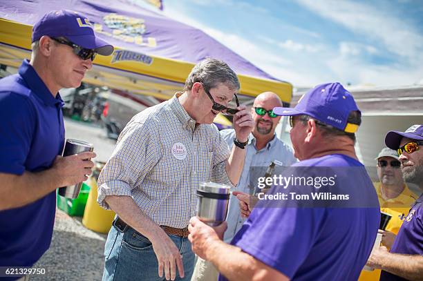 John Kennedy, Republican candidate for the U.S. Senate from Louisiana, greets fans at a tailgate party before a football game between the Louisiana...