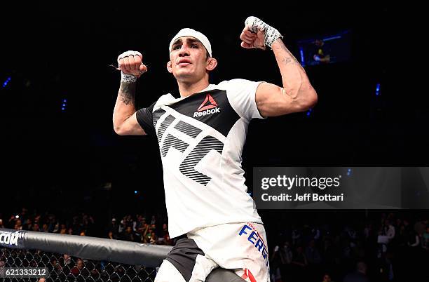 Tony Ferguson of the United States celebrates his victory over Rafael Dos Anjos of Brazil in their lightweight bout during the UFC Fight Night event...