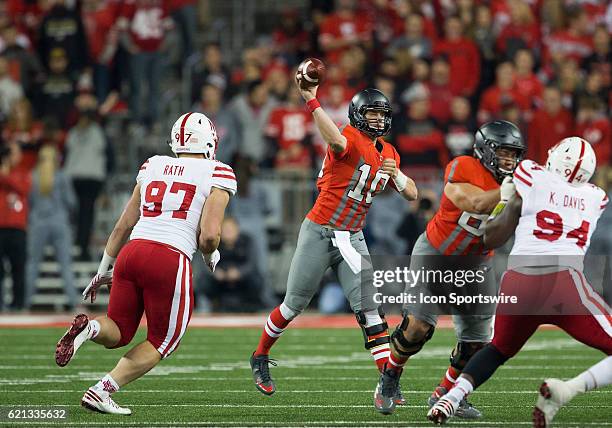 Quarterback Joe Burrow of the Ohio State Buckeyes makes a pass during an NCAA football game between the Nebraska Cornhuskers and the Ohio State...