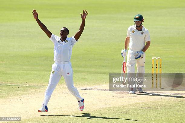 Kagiso Rabada of South Africa appeals successfully for the wicket of Shaun Marsh of Australia during day four of the First Test match between...