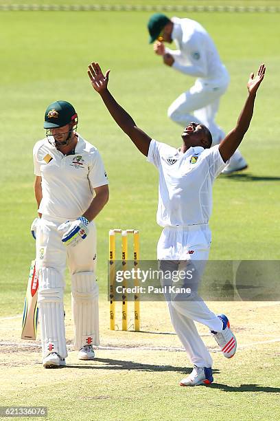 Kagiso Rabada of South Africa celebrates the wicket of Shaun Marsh of Australia during day four of the First Test match between Australia and South...