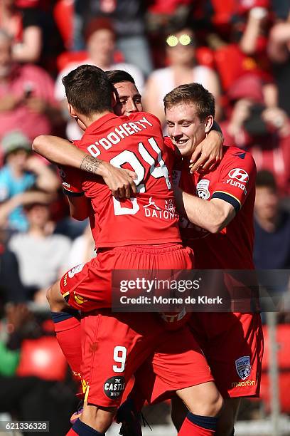 Sergio Guardiola of Adelaide United celebrates with teammates after scoring a goal from a penalty kick during the round five A-League match between...