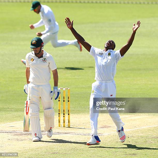 Kagiso Rabada of South Africa celebrates the wicket of Shaun Marsh of Australia during day four of the First Test match between Australia and South...