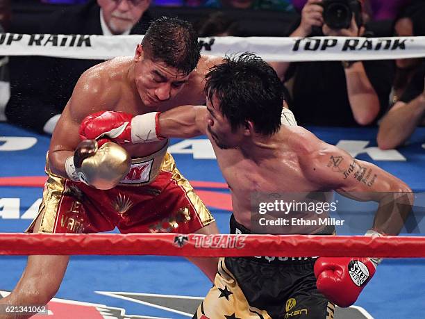 Manny Pacquiao hits Jessie Vargas iwith a right in the 12th round of their WBO welterweight championship fight at the Thomas & Mack Center on...