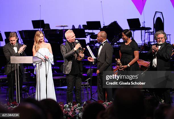 Peter Jueptner, EMEA Presidentn Estee Lauder Companies, Charlott Cordes, Fashion Designer Jean Paul Gaultier with 'World without AIDS' Award and...