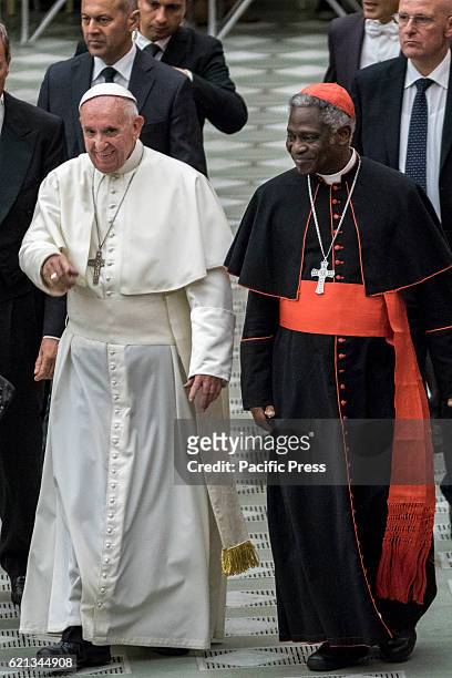 Pope Francis and Cardinal Peter Kodwo Appiah Turkson attend an audience with representatives of Third World Meeting of Popular Movements in Paul VI...