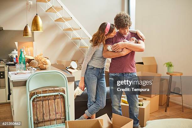 moving home new beginnings. couple with baby. - futuristic home stock pictures, royalty-free photos & images