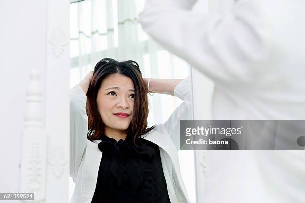 tired businesswoman looking at herself - ugly woman stock pictures, royalty-free photos & images