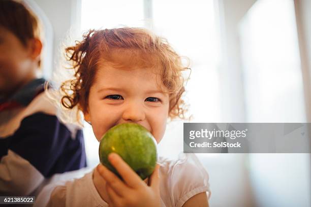 my tasty green apple - child eating a fruit stock pictures, royalty-free photos & images