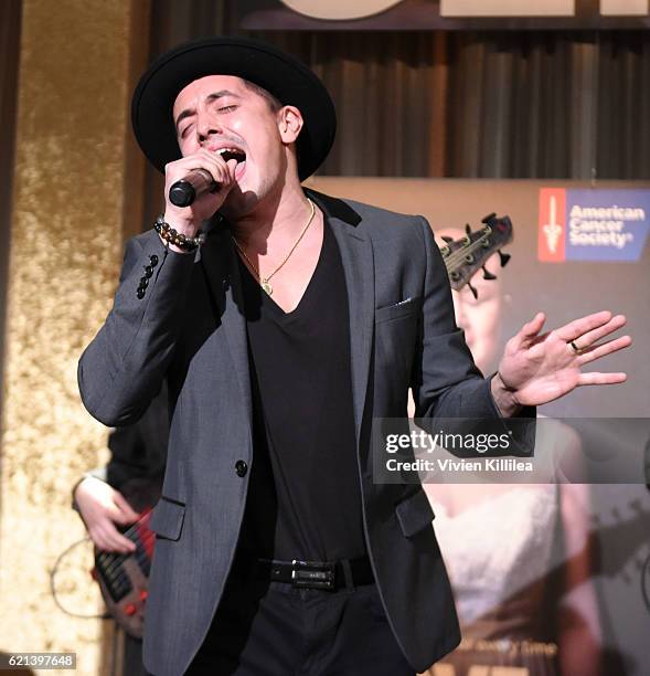 Singer Stefano Langone performs on stage with The Inconvenient Truth Band at American Cancer Society's Giants of Science Los Angeles Gala on November...