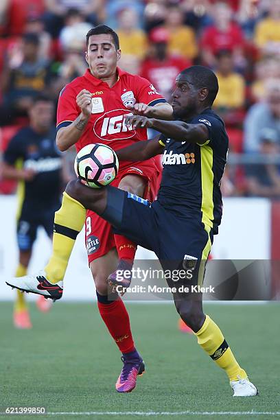 Sergio Guardiola of Adelaide United competes for the ball with Jacques Faty of the Central Coast Mariners during the round five A-League match...