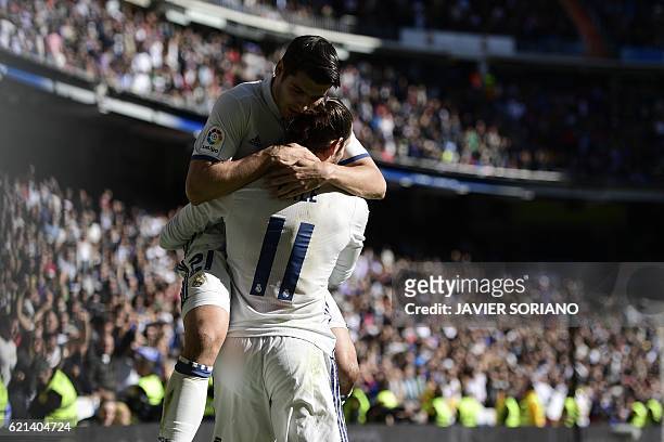 Real Madrid's Welsh forward Gareth Bale and Real Madrid's forward Alvaro Morata celebrate after scoring a goal during the Spanish league football...