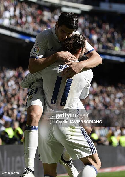 Real Madrid's Welsh forward Gareth Bale and Real Madrid's forward Alvaro Morata celebrate after scoring a goal during the Spanish league football...