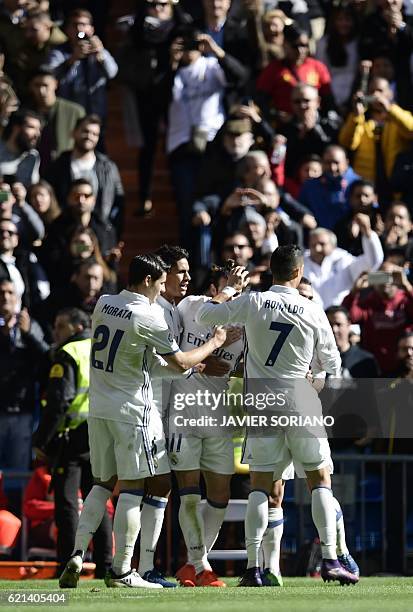 Real Madrid players celebrates after scoring a goal during the Spanish league football match Real Madrid CF vs Club Deportivo Leganes SAD at the...