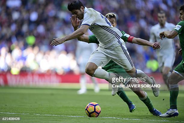Real Madrid's forward Alvaro Morata scores past Leganes's Italian defender Mantovani during the Spanish league football match Real Madrid CF vs Club...