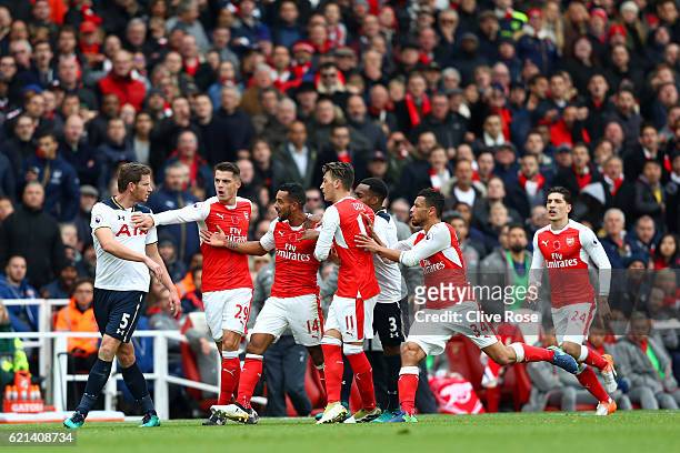 Jan Vertonghen of Tottenham Hotspur and Theo Walcott of Arsenal clash during the Premier League match between Arsenal and Tottenham Hotspur at...