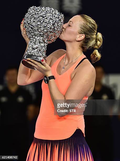 Petra Kvitova of the Czech Republic kisses her trophy after winning the singles final match against Elina Svitolina of Ukraine at the WTA Elite...