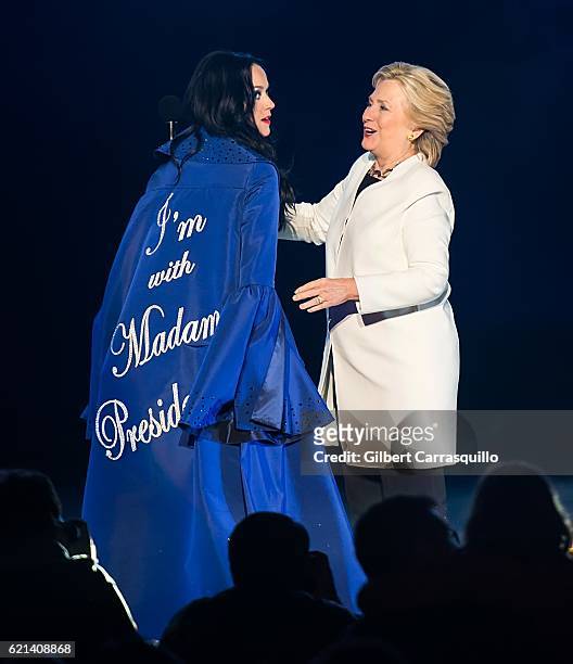 Singer-songwriter, Katy Perry and Democratic presidential nominee former Secretary of State Hillary Rodham Clinton on stage during Katy Perry holds...