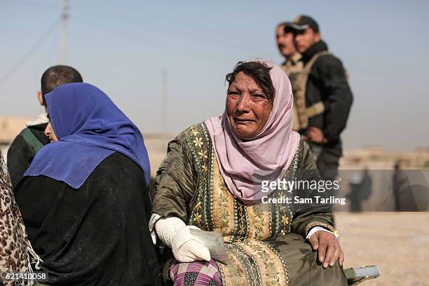 Wounded civilian sits on a cot bed after receiving treatment in the Zahara neighbourhood on the north eastern edge of Mosul as fighting continues...