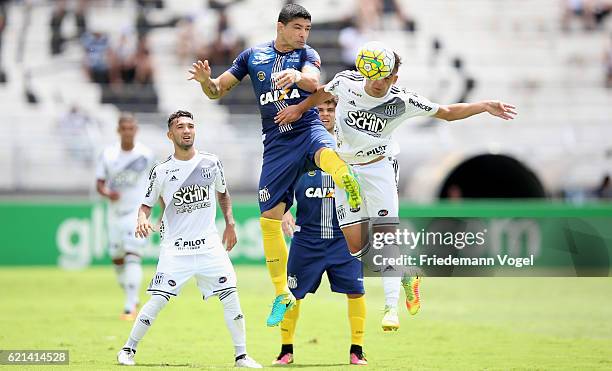 Renato of Santos fights for the ball with Maycon of Ponte Preta during the match between Ponte Preta and Santos for the Brazilian Series A 2016 at...