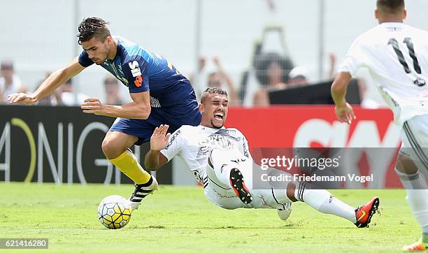 Zeca of Santos fights for the ball with Pottker of Ponte Preta during the match between Ponte Preta and Santos for the Brazilian Series A 2016 at...